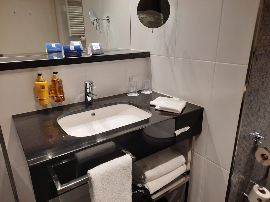 a bathroom with a sink and towels