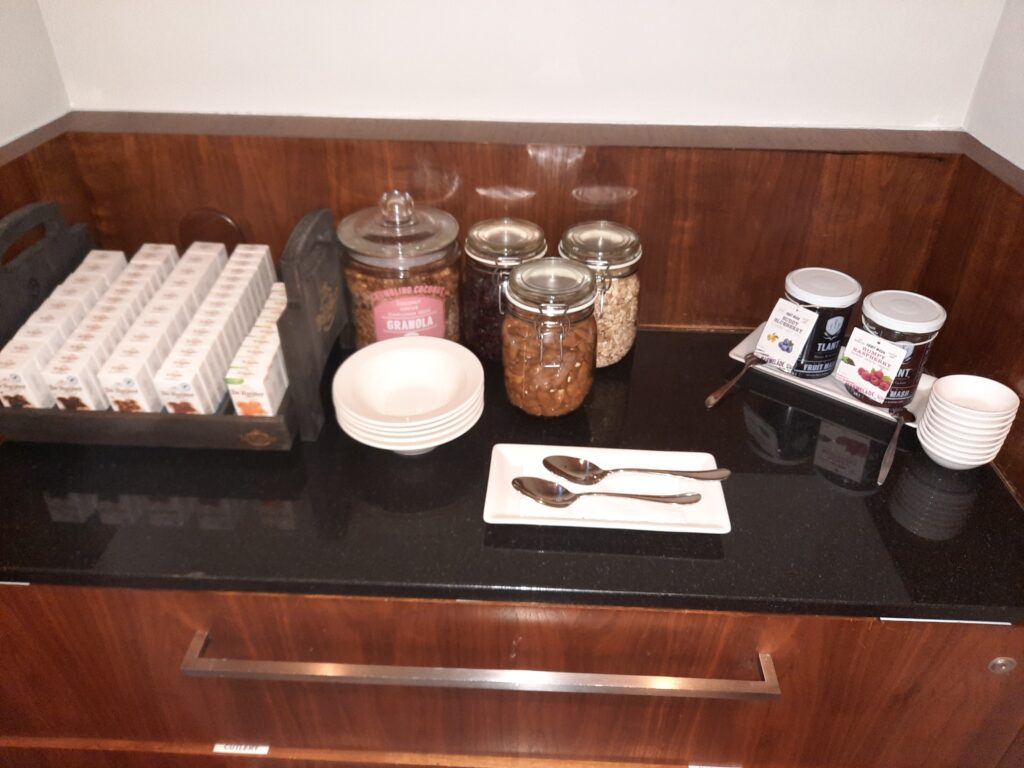 a counter with food and utensils on it