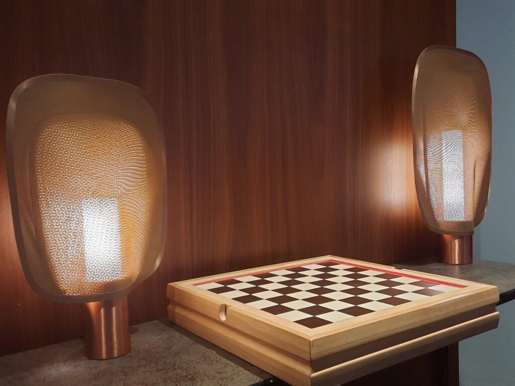 a chess board and lamps on a table