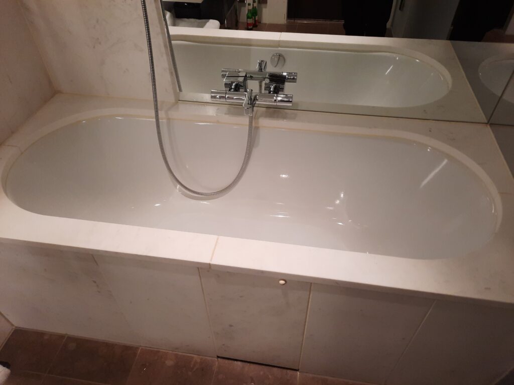a bathtub with a shower head