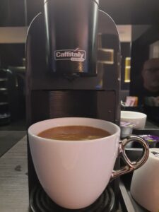 a coffee machine with a cup of coffee