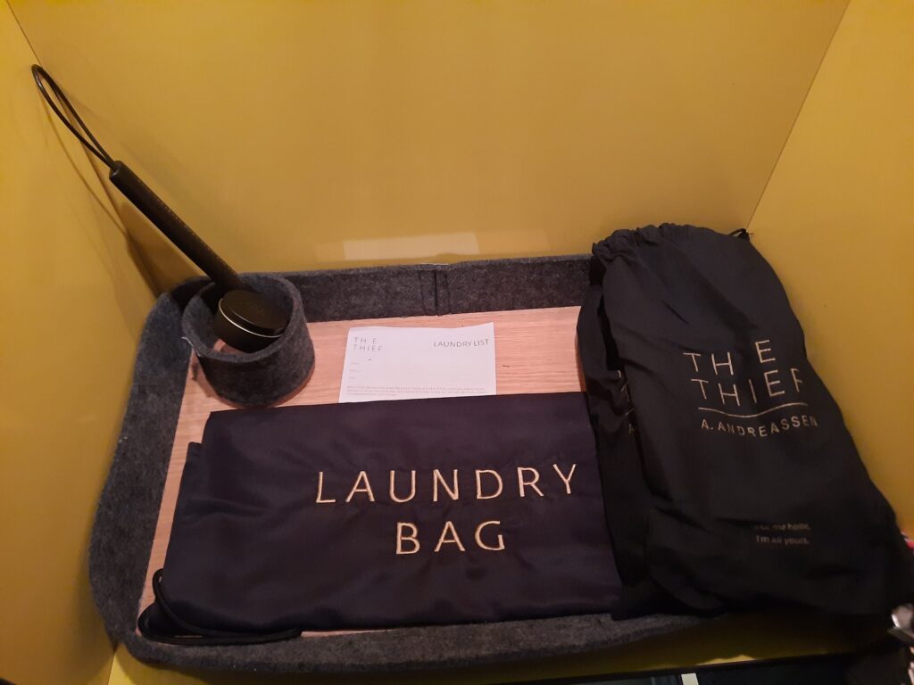 a laundry bag and a bag on a tray