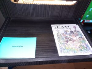 a magazine and a piece of paper on a table
