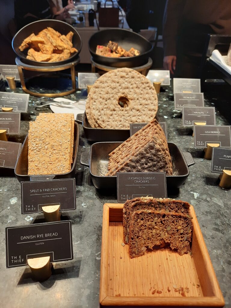 a table with different types of bread and crackers