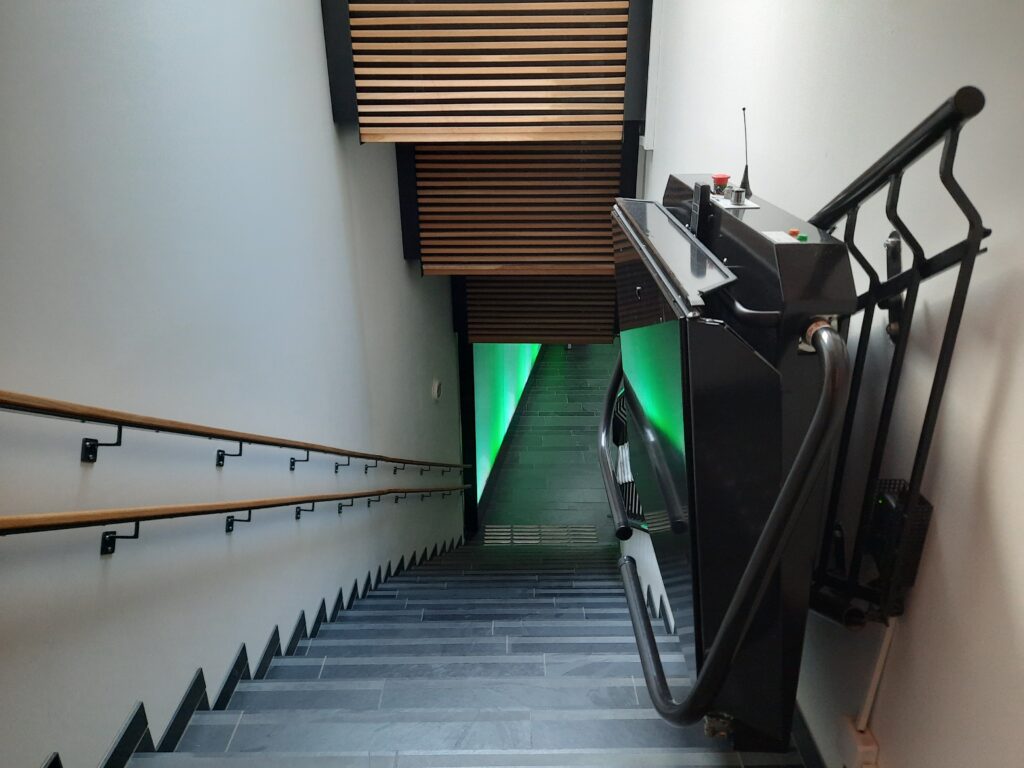 a staircase with a green light
