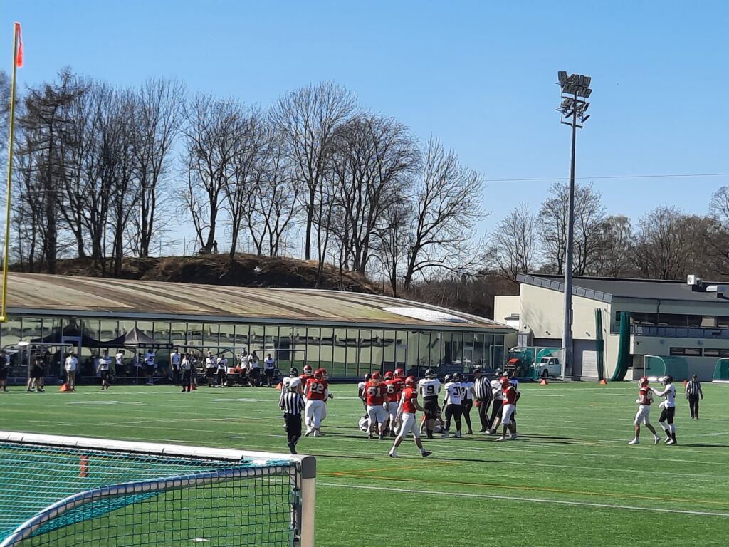 a group of people on a football field