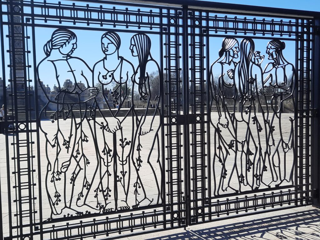 a gate with a drawing of women on it