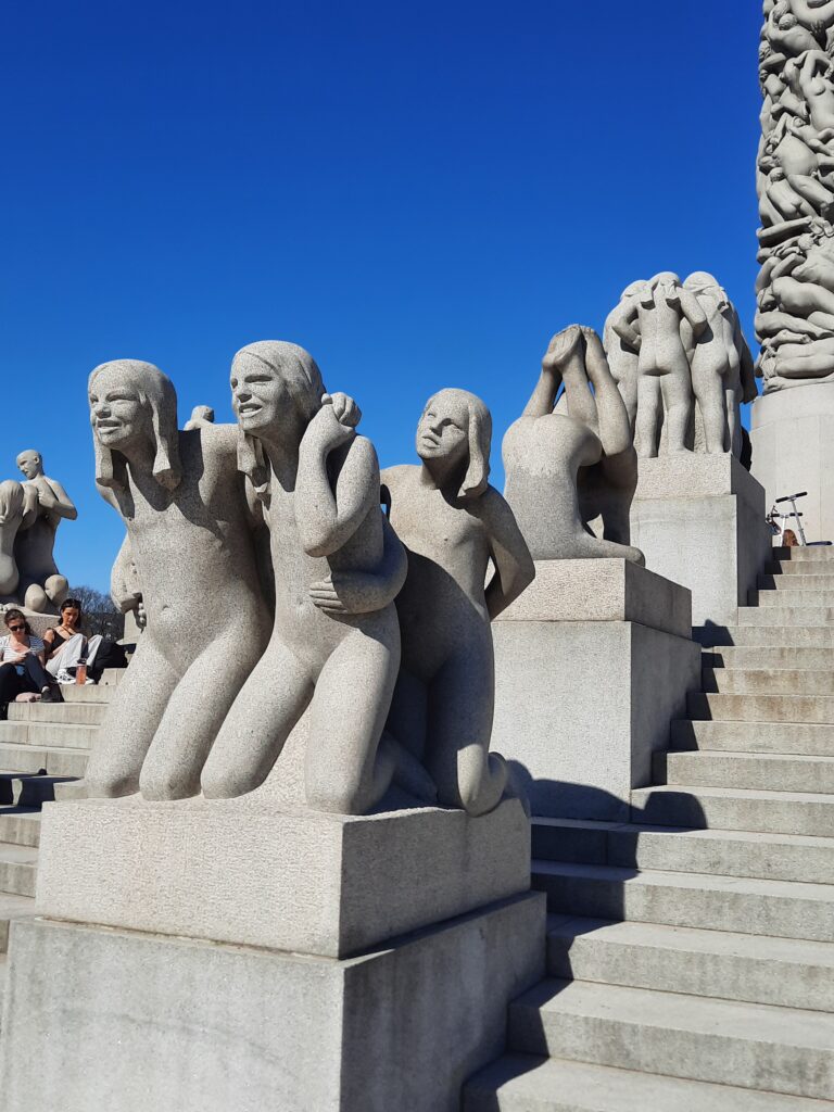 a group of statues of people
