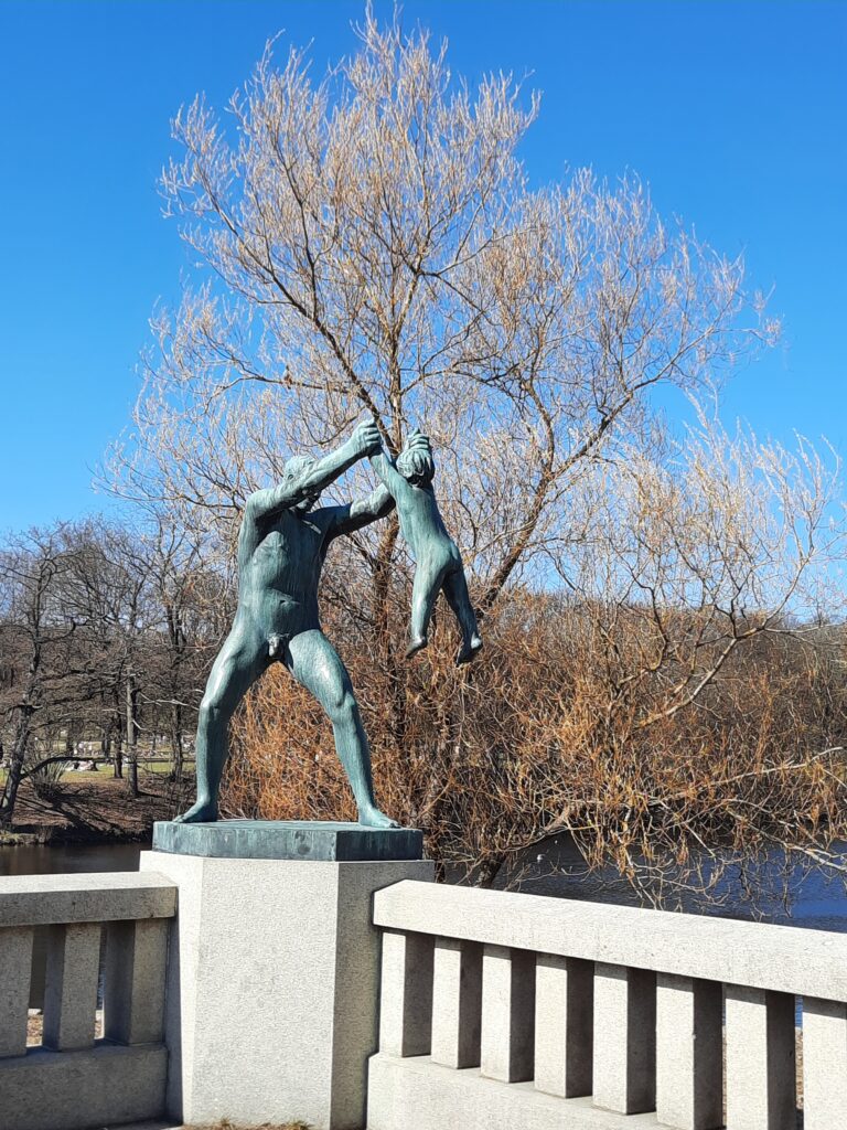 a statue of a man holding a baby