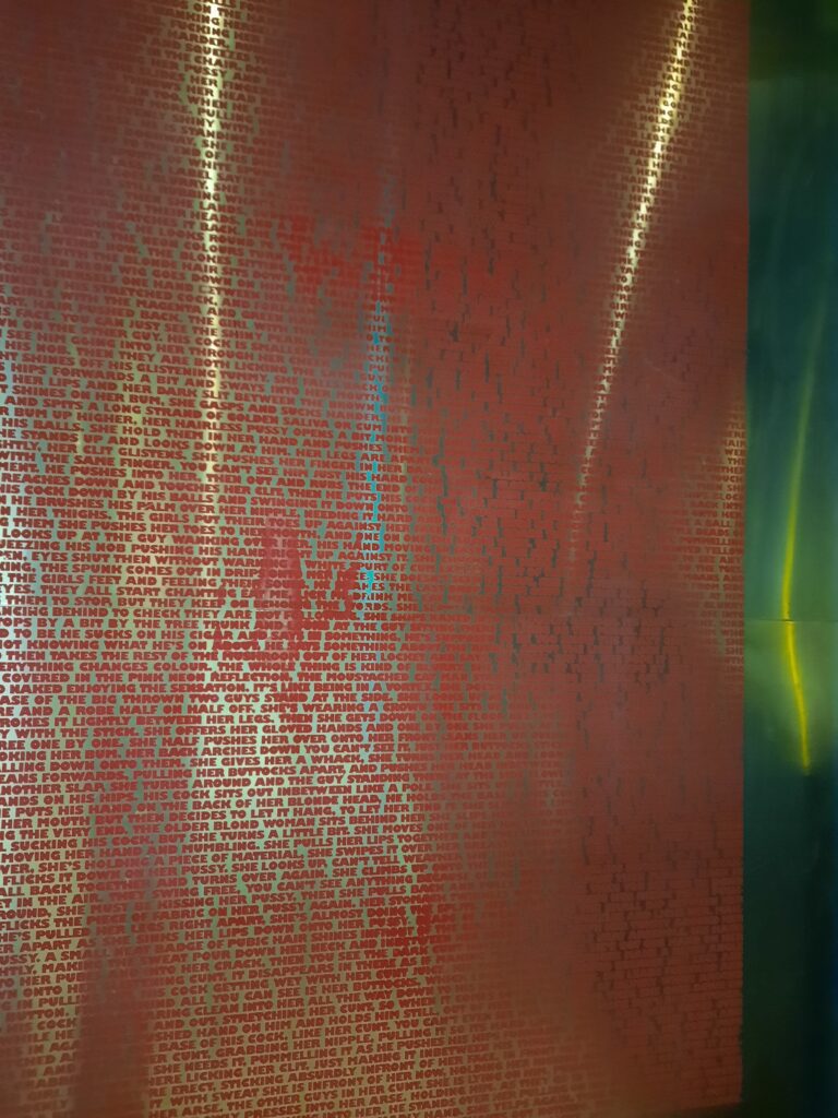 a red and green wall with writing on it