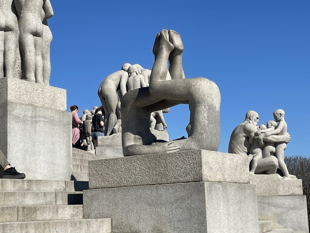 a group of statues of people