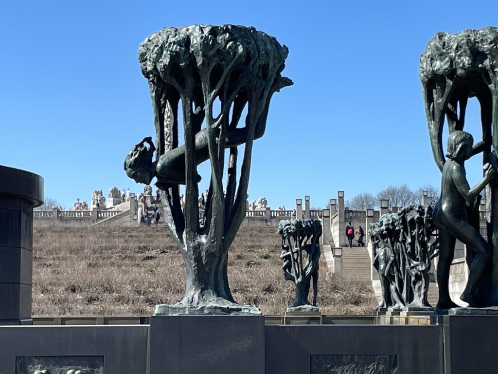 a group of statues in a field